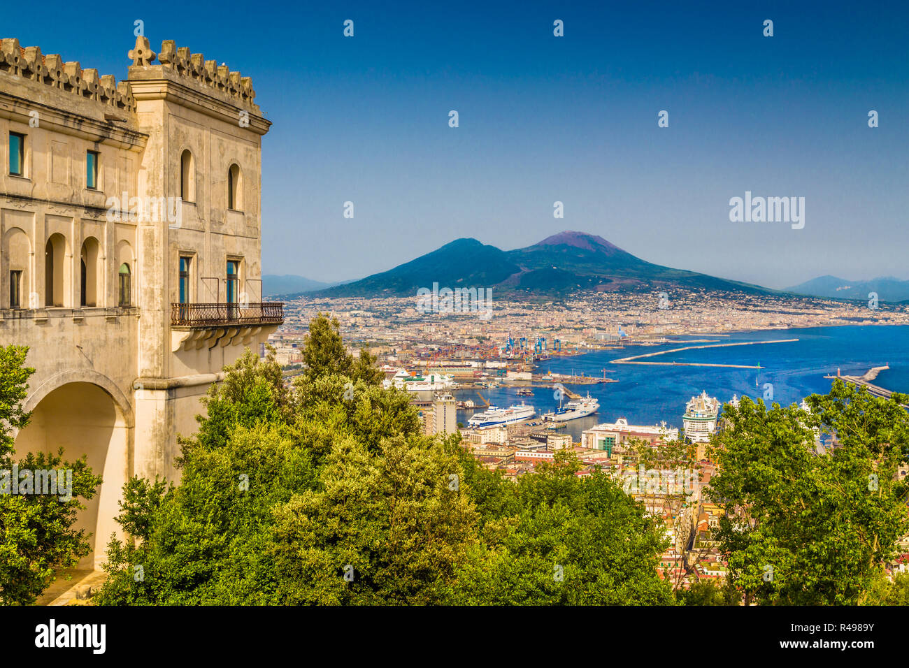 Scenic picture-postcard view of the city of Naples (Napoli) with famous Mount Vesuvius in the background from Certosa di San Martino monastery, Campan Stock Photo