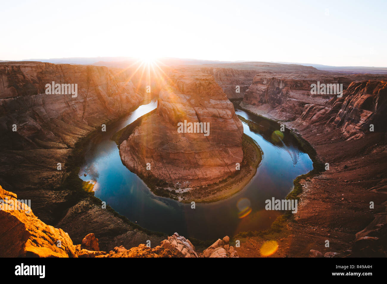 Classic wide-angle sunset view of famous Horseshoe Bend, a horseshoe-shaped meander of the Colorado River located near the town of Page, Arizona, USA Stock Photo