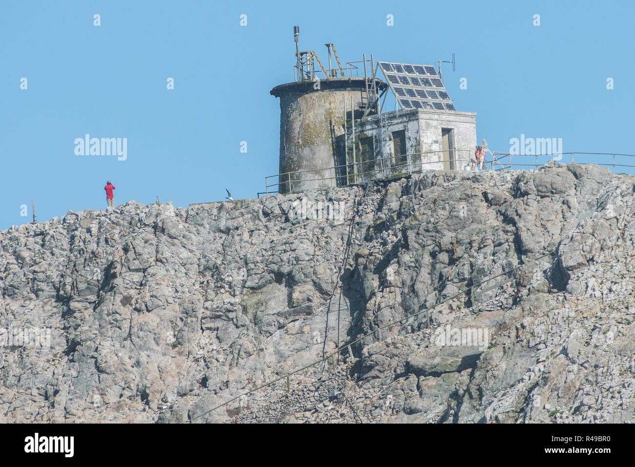 Farallon island light is one of three buildings on the Farallon islands, it sits ontop of the tallest hill and overlooks the water. Stock Photo