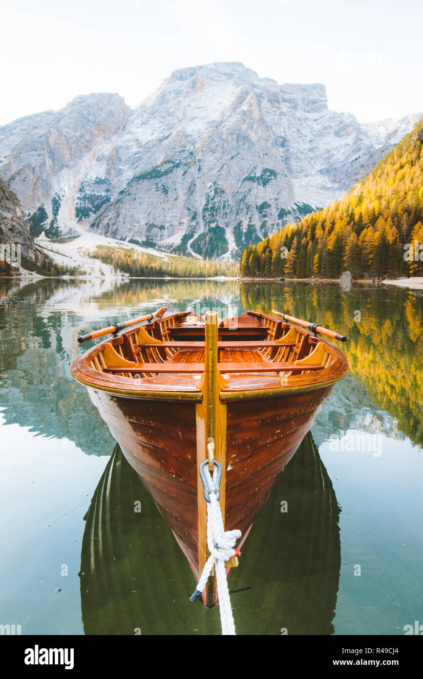 Beautiful view of traditional wooden rowing boat on scenic Lago di Braies in the Dolomites in scenic morning light at sunrise, South Tyrol, Italy Stock Photo
