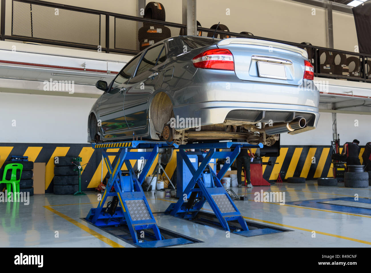 car on Car lifts and Remove wheel for maintenance Stock Photo Alamy