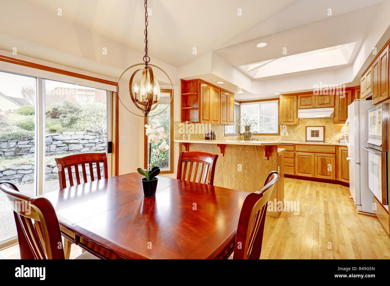 Kitchen Room Interior In American House With Cherry Wood Dining