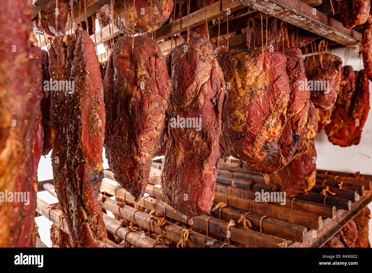 Meat hanging on hooks hi-res stock photography and images - Alamy