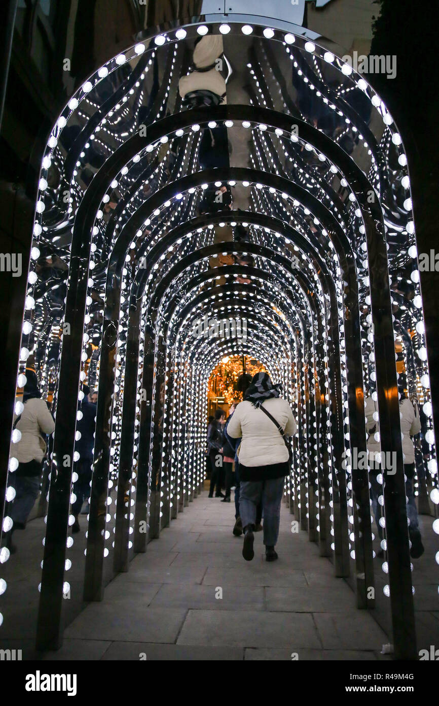 The passage to Conduit Court in Covent Gardens is seen covered with mirrors and lights for the festive season. Stock Photo
