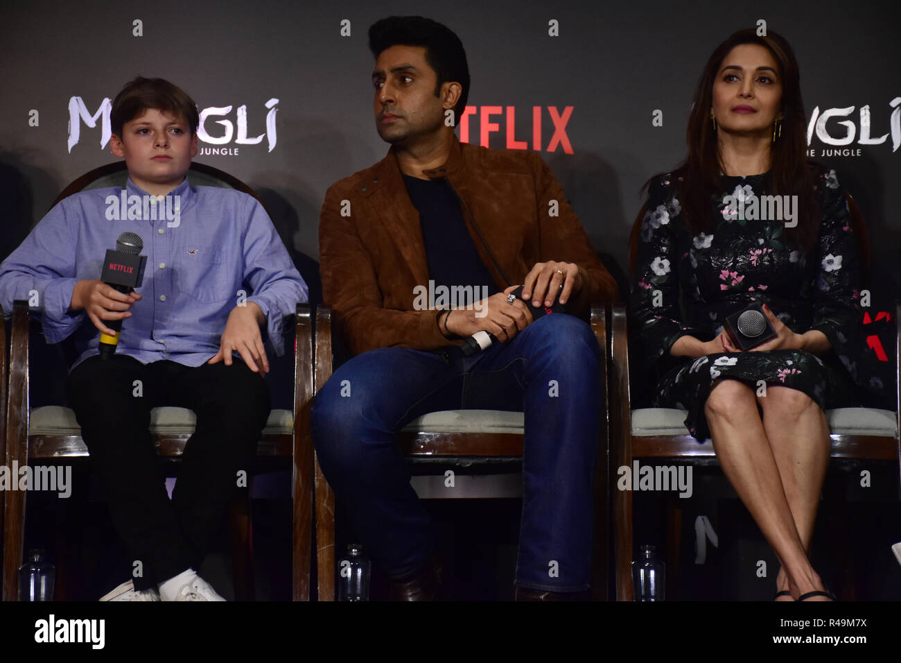 Mumbai, India. 25th Nov, 2018. (L-R) Actrors Louis Serkis, Abhishek Bachchan and Madhuri Dixit present at the trailer launch and press conference of Netflix’s 'Mowgli - Legend of the Jungle' Hindi version at hotel JW Marriott, Juhu in Mumbai. Credit: SOPA Images Limited/Alamy Live News Stock Photo