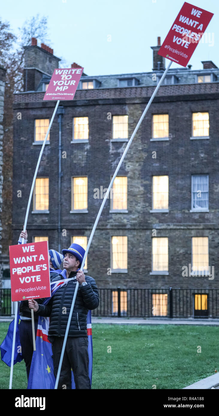Westminster, London, 26th Nov 2018. SODEM founder Steve Bray, often referred to as the 'Shouty Man', and a fellow activist have mounted their placards onto poles to ensure they are seen in TV coverage from the newly erected media platforms at Victoria Tower Gardens. Anti-Brexit Protesters from SODEM (Stand of Defiance European Movement) rally outside the Houses of Parliament and near media reporters and crews at College Green in Westminster. Credit: Imageplotter News and Sports/Alamy Live News Stock Photo