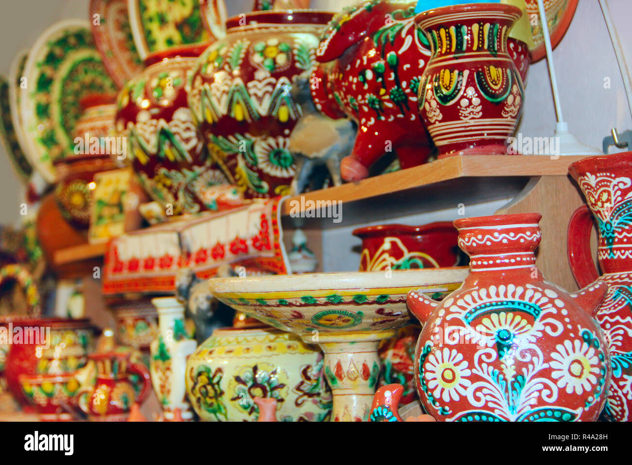 Wide choice of ceramic products on shelf of store. Pottery for sale. Ceramic goods. Products of ceramics on sale Stock Photo