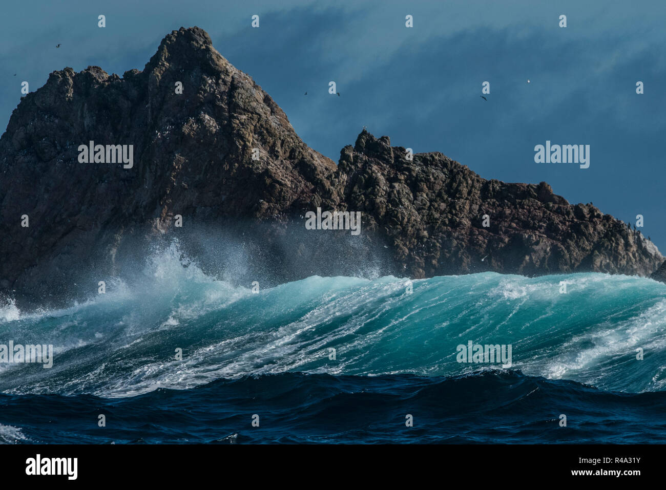 The Farallon islands jutting out of the pacific ocean as big waves roll in. Stock Photo