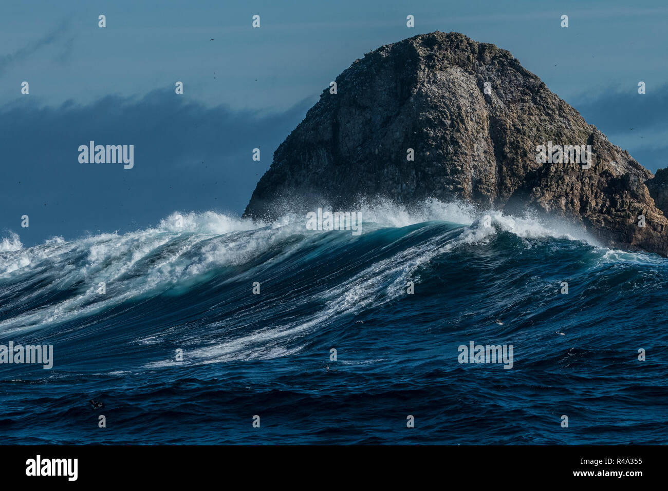 The Farallon islands jutting out of the pacific ocean as big waves roll in. Stock Photo