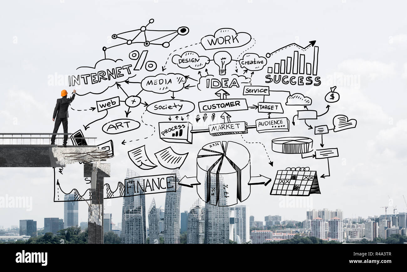 Businessman drawing business conceptual sketches Stock Photo - Alamy