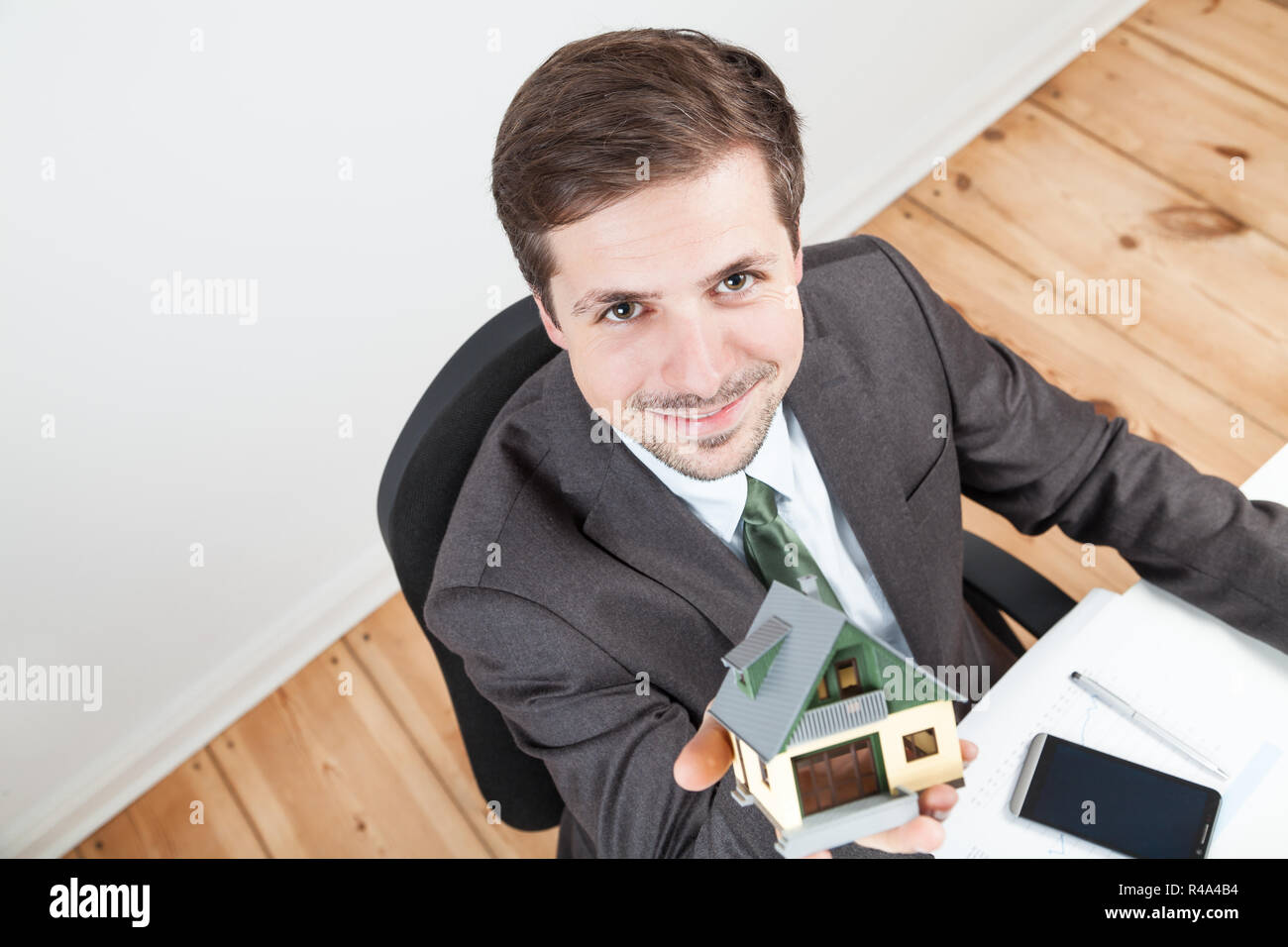 model house in businessman hands Stock Photo - Alamy