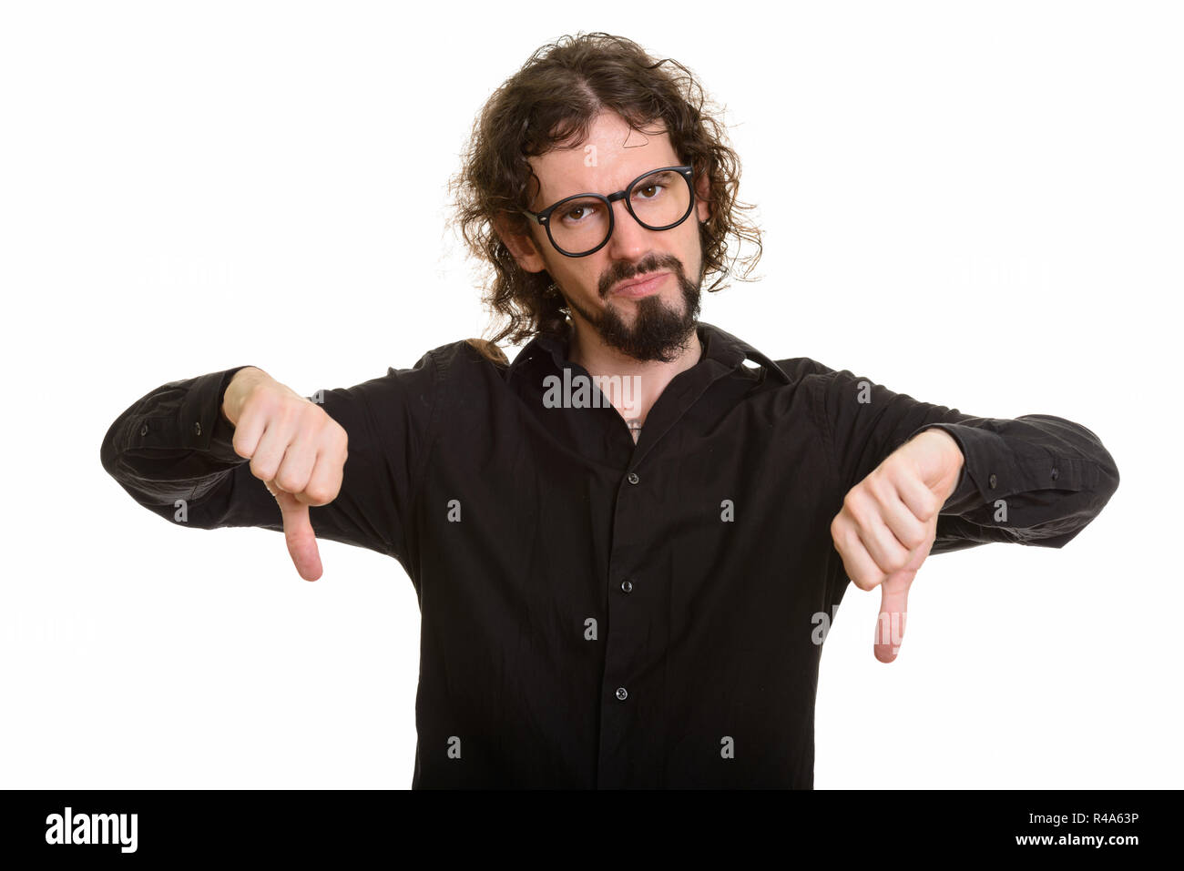 Portrait of handsome Caucasian man giving thumbs down Stock Photo