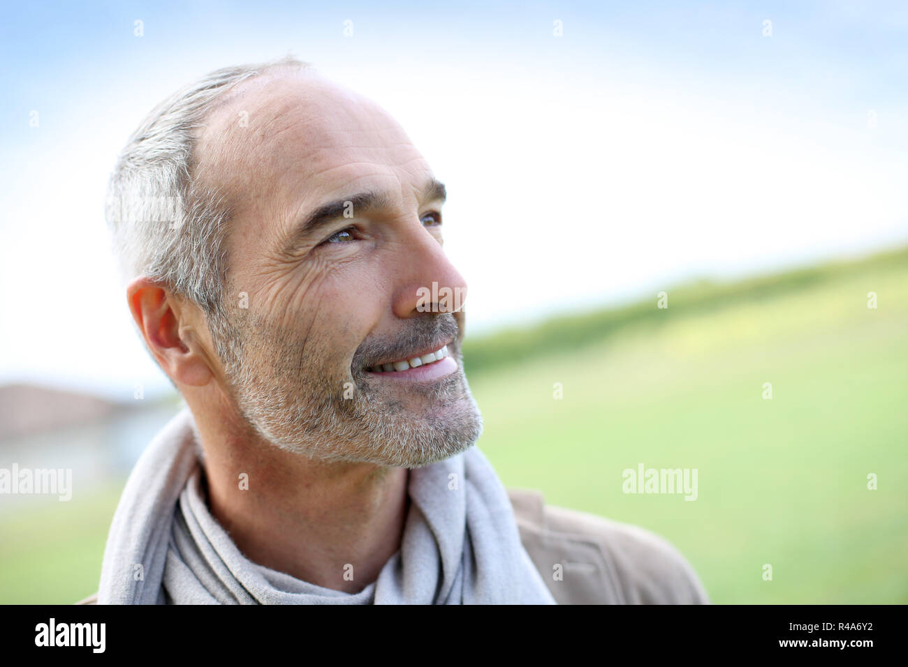 Portrait of smiling mature handsome guy Stock Photo - Alamy
