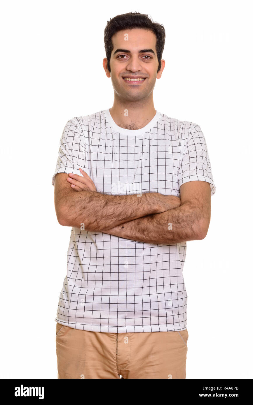 Portrait of young happy Persian man smiling with arms crossed Stock ...