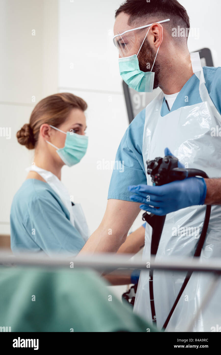 Team of doctors performing endoscopy in hospital Stock Photo - Alamy