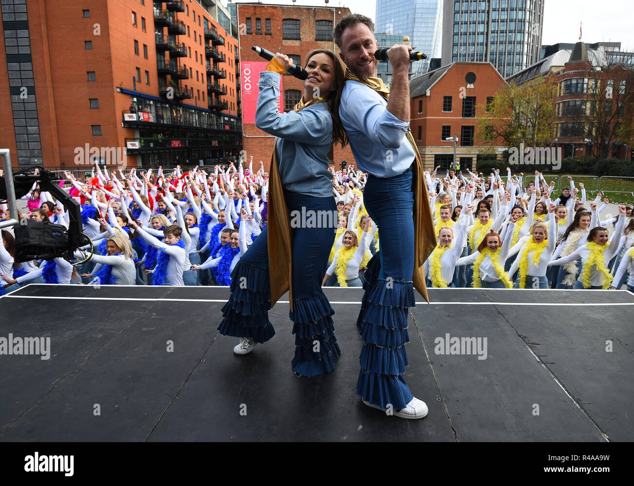 Ola and James Jordan join dancers in Waterloo, London, as they attempt to set the Guinness World record for 'the world's largest disco dance' to celebrate the launch of Mamma Mia! Here We Go Again on DVD. Stock Photo