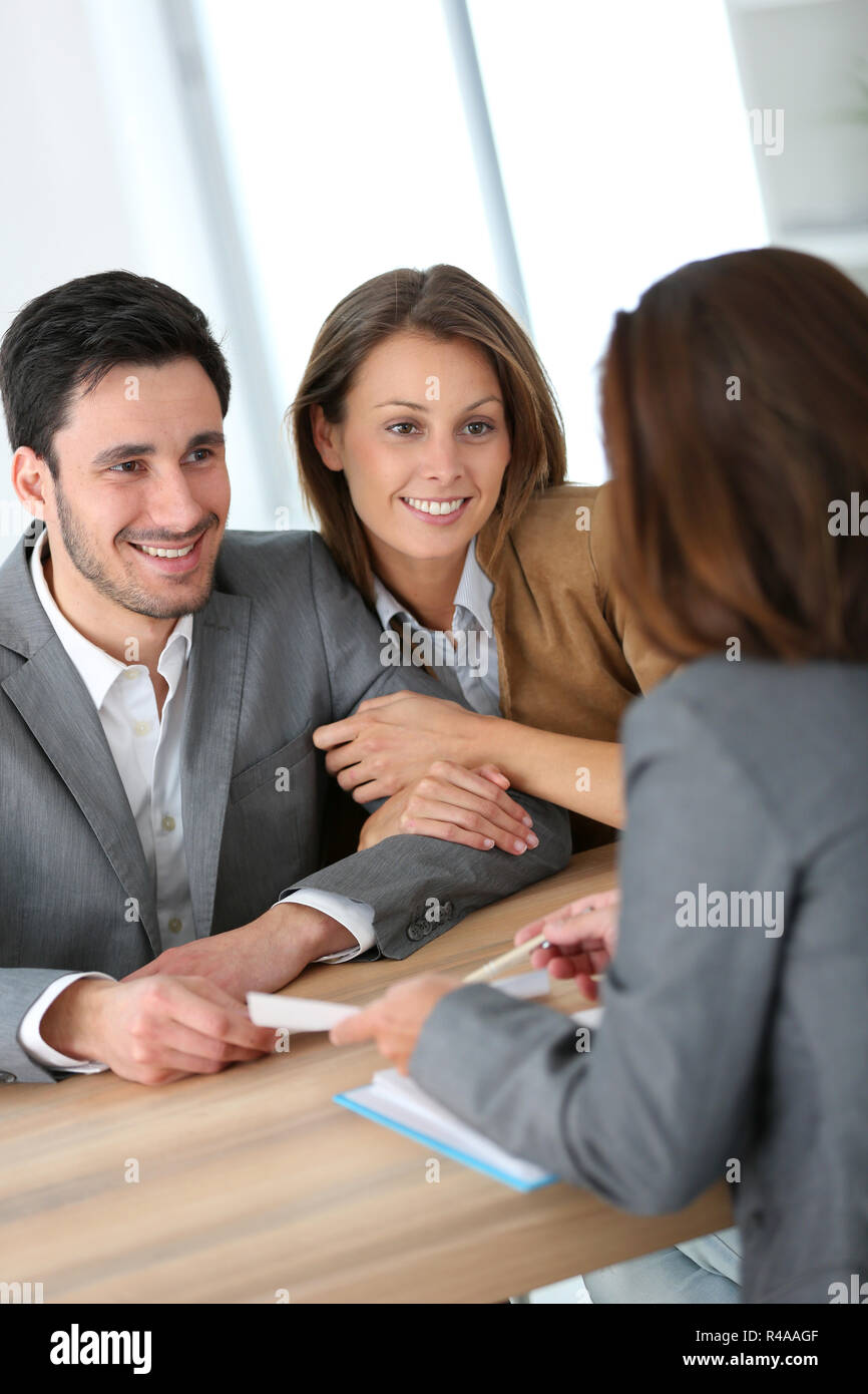 Couple meeting financial adviser for construction project Stock Photo
