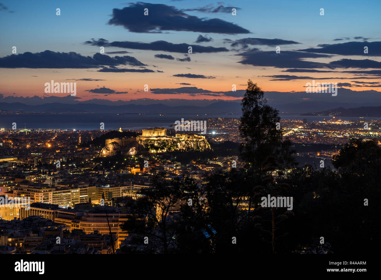 Sunset shot of Athens, Greece from above. In the center, the hill of the Acropolis. Stock Photo