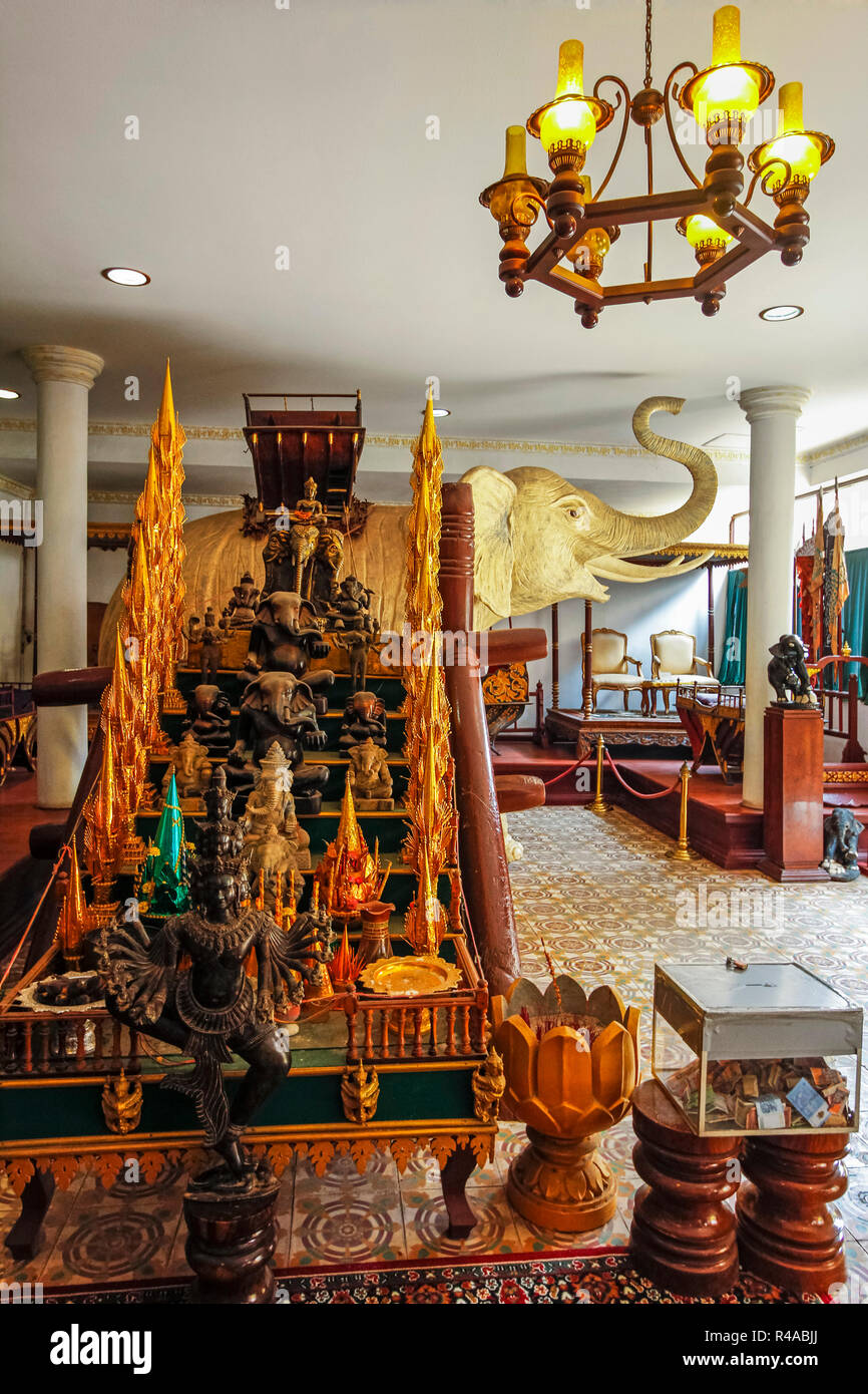 Large white elephant statue and other items in a Royal Palace exhibition room; Royal Palace, City Centre, Phnom Penh, Cambodia Stock Photo