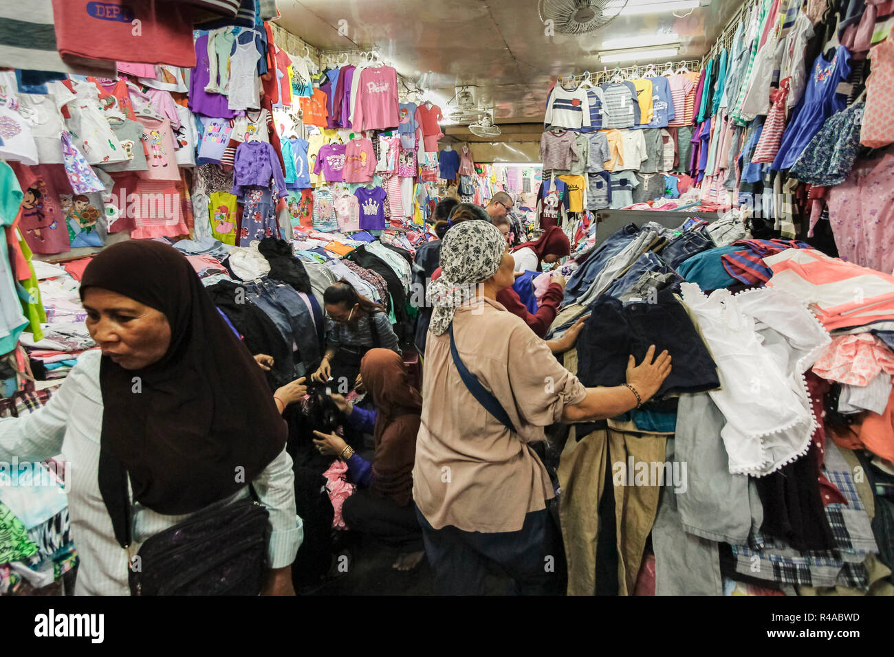 Local women & piles of cheap clothing for sale at the Toul Tum Poung  Russian Market. Toul Tum Poung, city centre, Phnom Penh, Cambodia Stock  Photo - Alamy