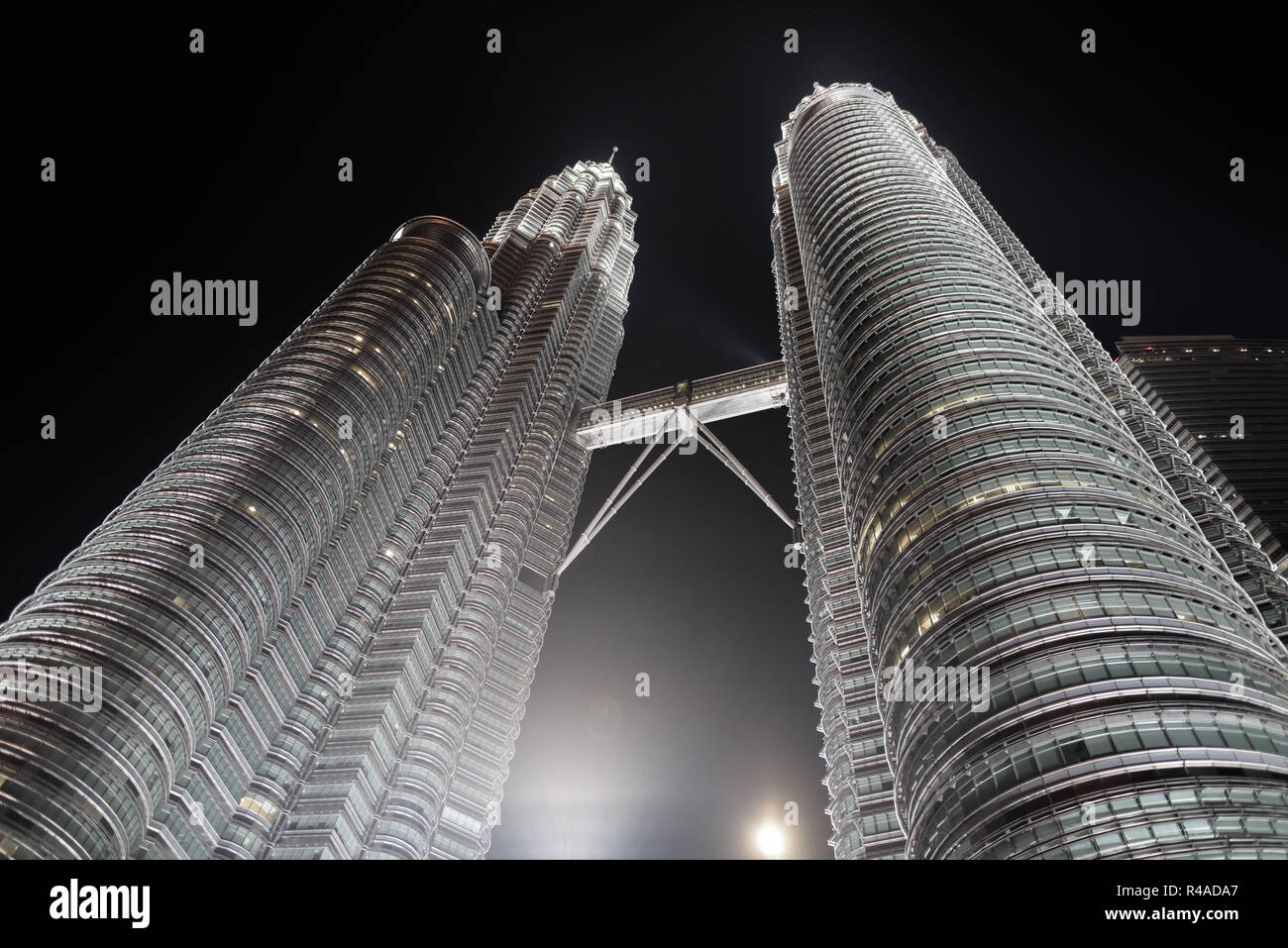 The Famous Petronas Towers At Night In Kuala Lumpur, Malaysia Stock Photo