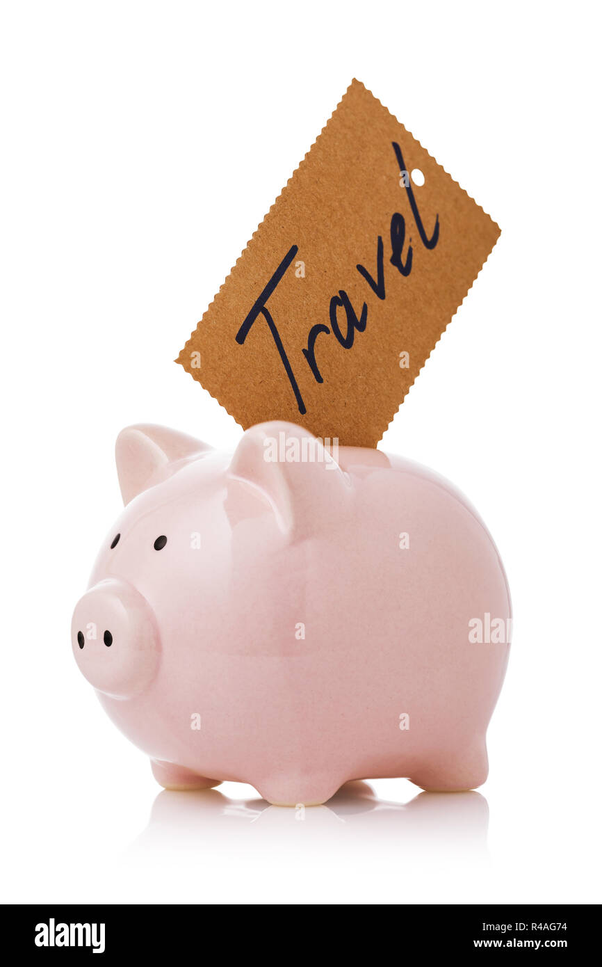 Accumulate travel money. Piggy bank with sticker isolated on white background Stock Photo