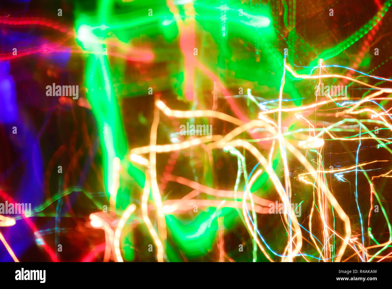 Defocused abstract multicolored bokeh lights background. Blue, purple, green, orange colors Stock Photo