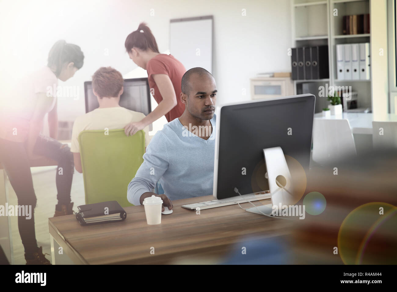 Man working on desktop computer Stock Photo - Alamy