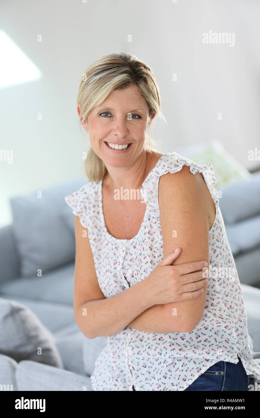 Beautiful 40-year old woman at home Stock Photo