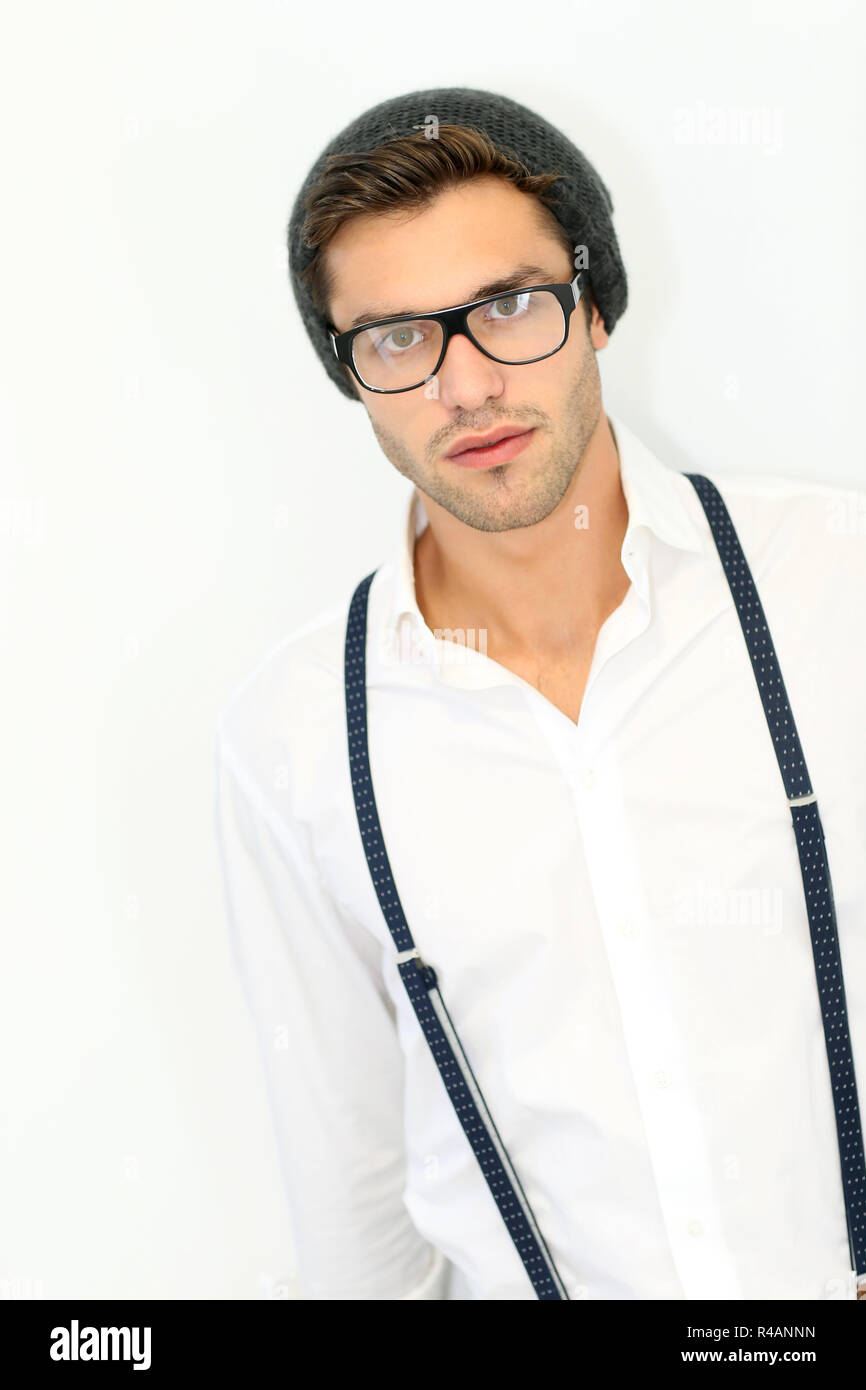 Trendy guy with suspenders and eyeglasses, isolated Stock Photo - Alamy