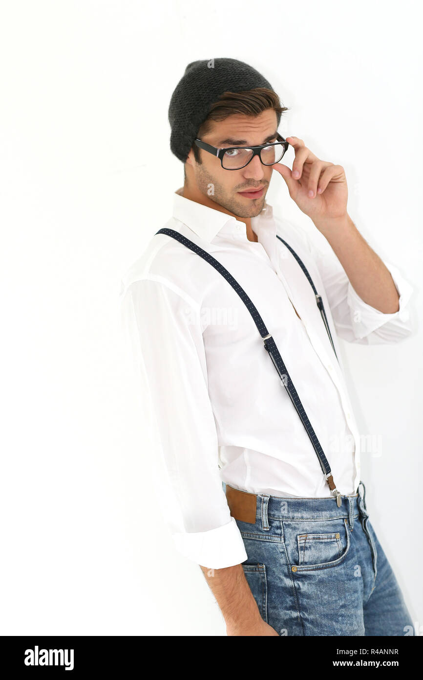 Trendy guy with suspenders and eyeglasses, isolated Stock Photo Alamy