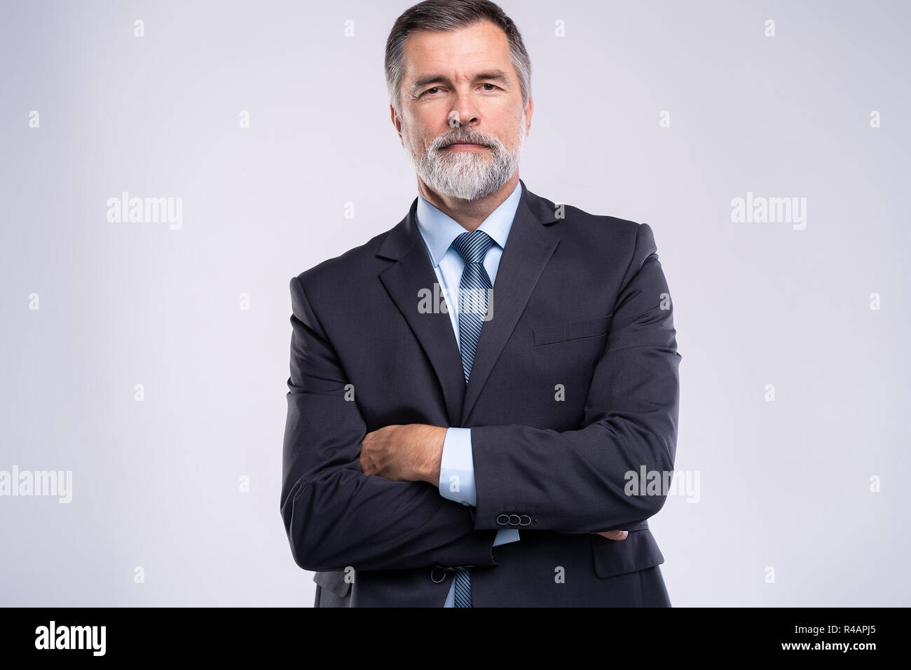 Happy satisfied mature businessman looking at camera isolated on white ...