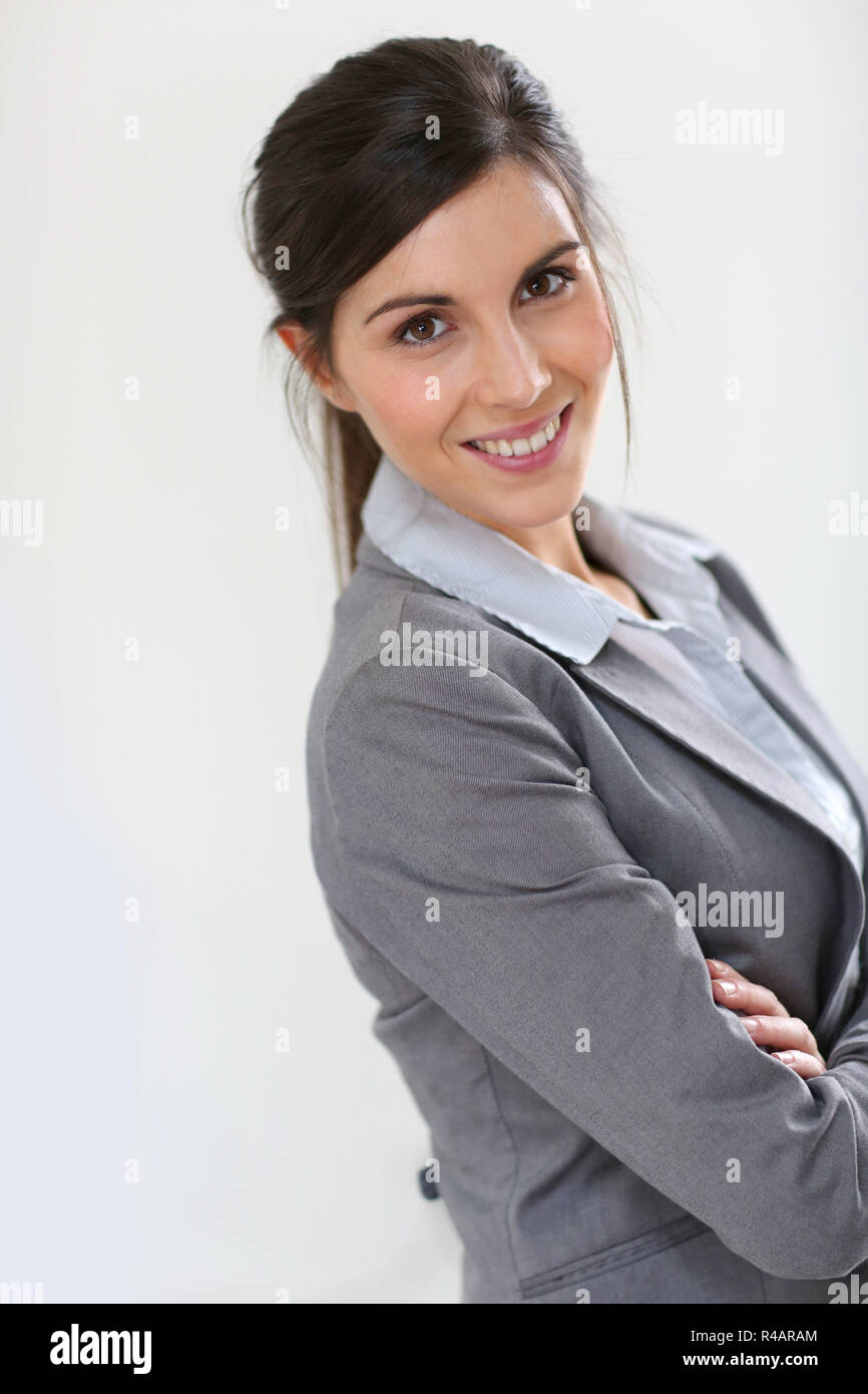 Smiling business girl standing on white background Stock Photo - Alamy