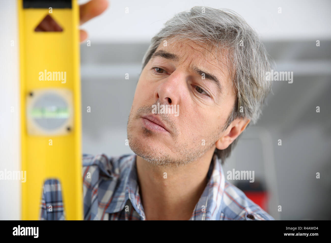 Closeup of craftsman using level Stock Photo - Alamy