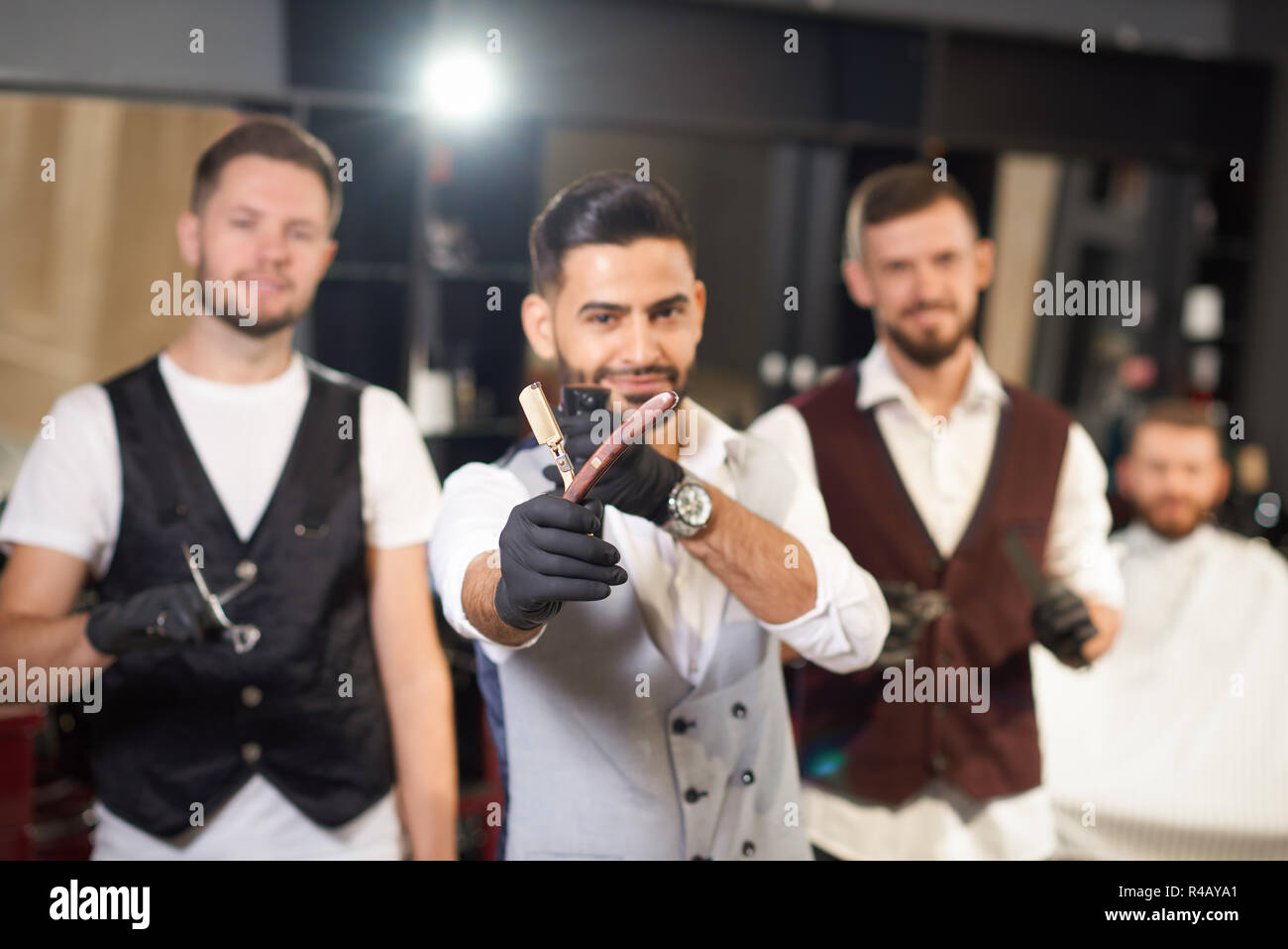 Selective Focus Of Straight Razor In Hands Of Stylish Hairdresser