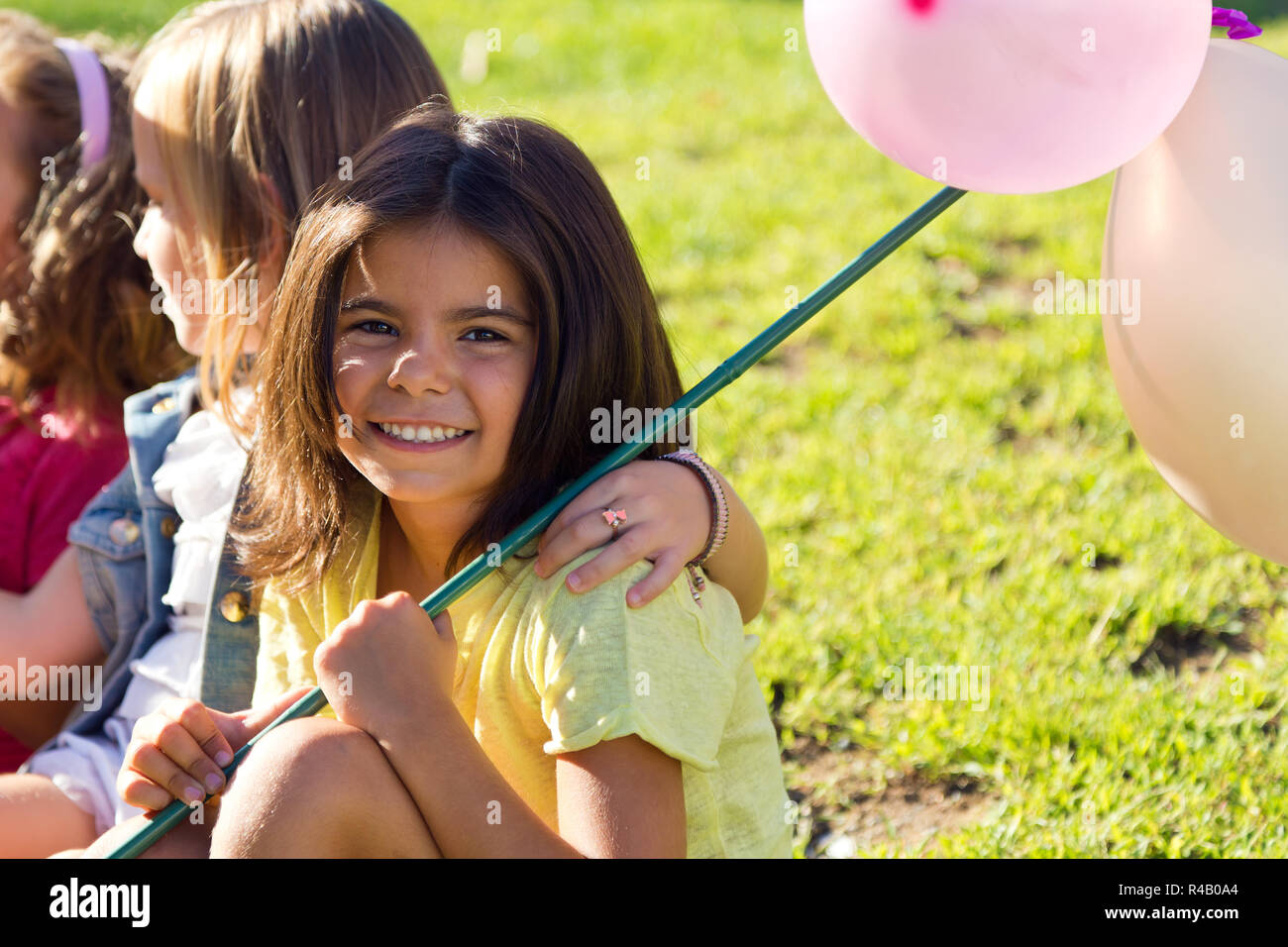 Group of childrens having fun in the park Stock Photo - Alamy