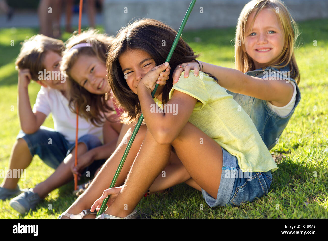 Group of childrens having fun in the park Stock Photo - Alamy