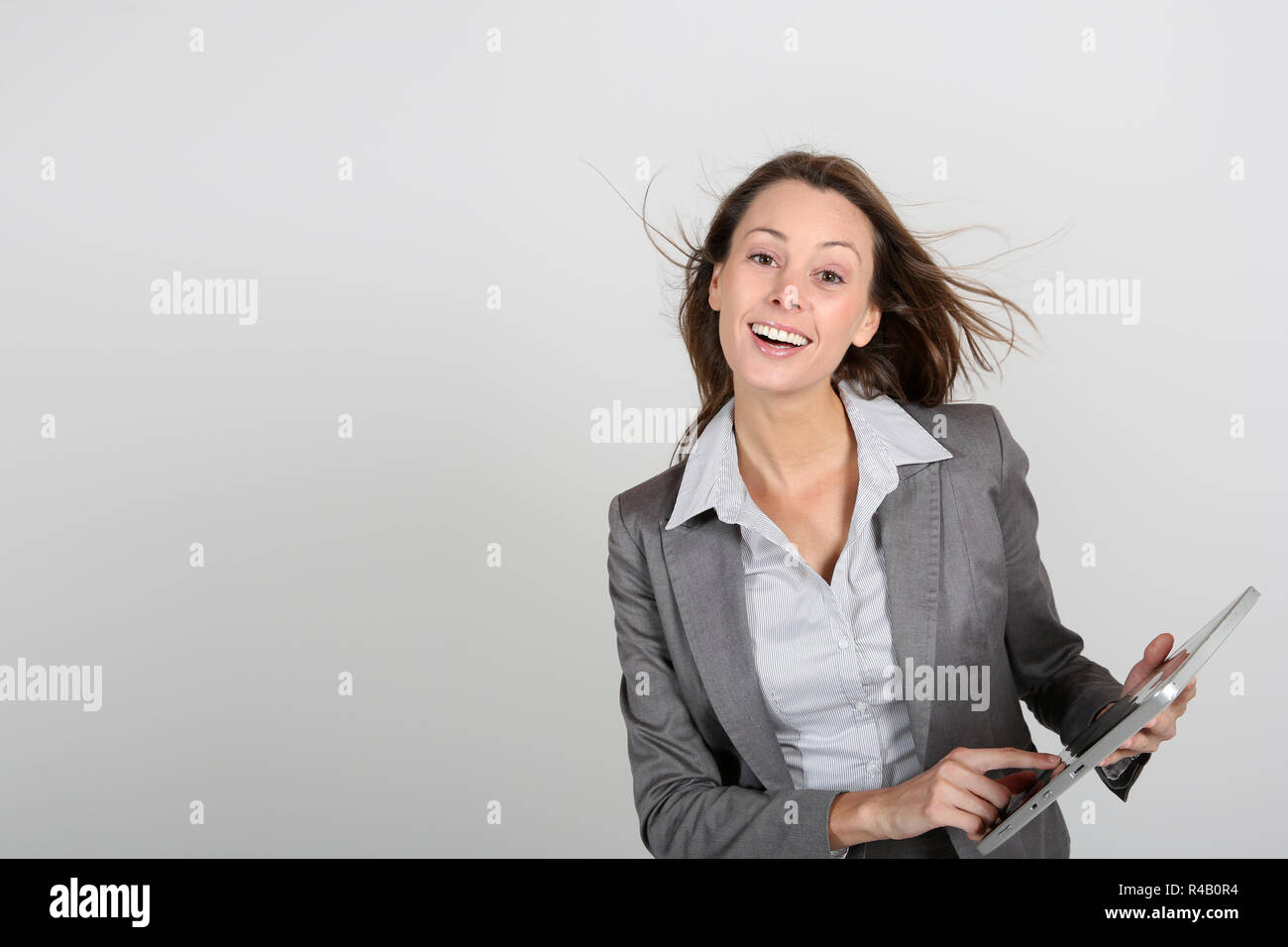 Smiling businesswoman using digital tablet Stock Photo