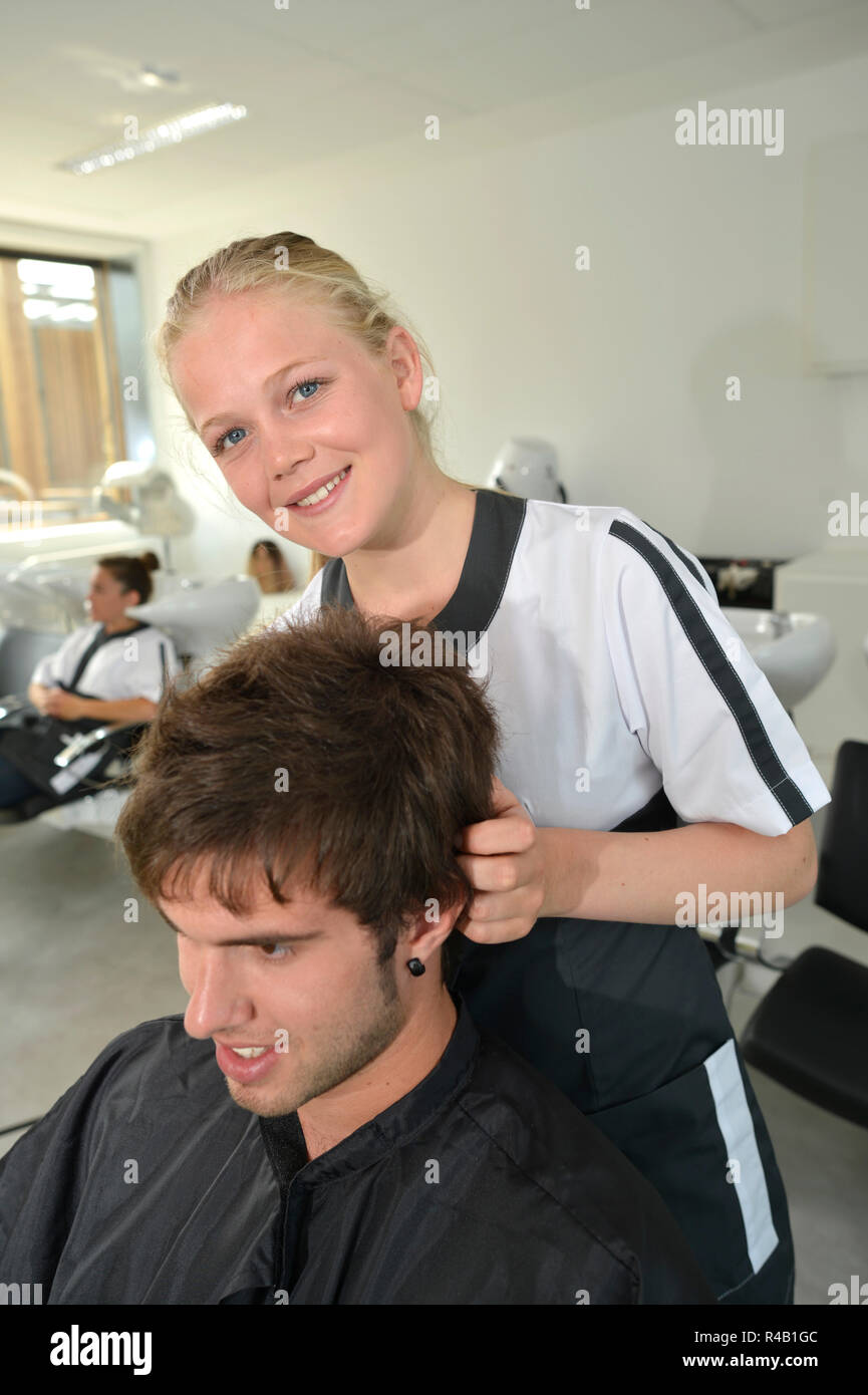 Portrait of hairdressing student girl in hair salon Stock Photo Alamy