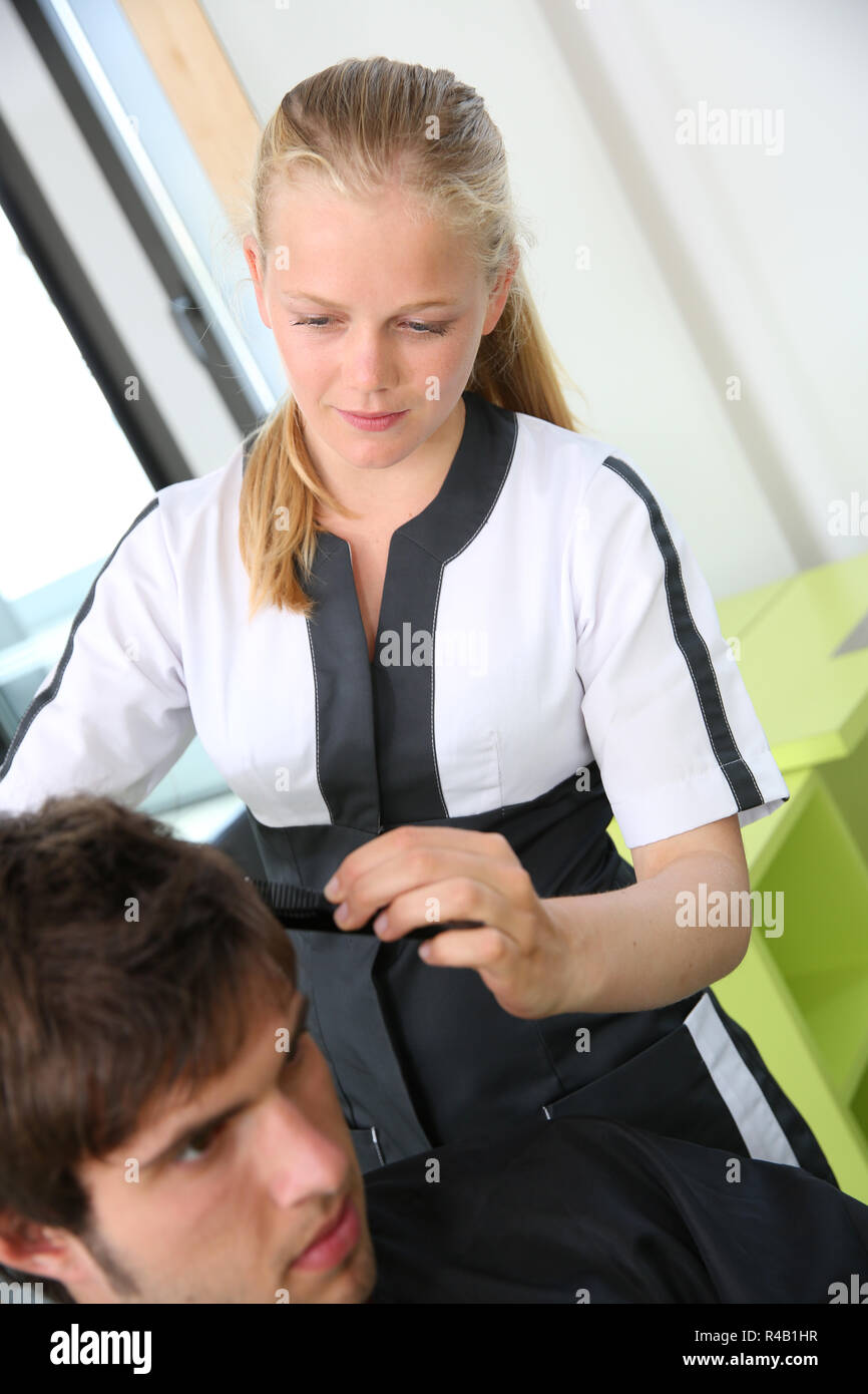 Portrait of hairdressing student girl in hair salon Stock Photo Alamy