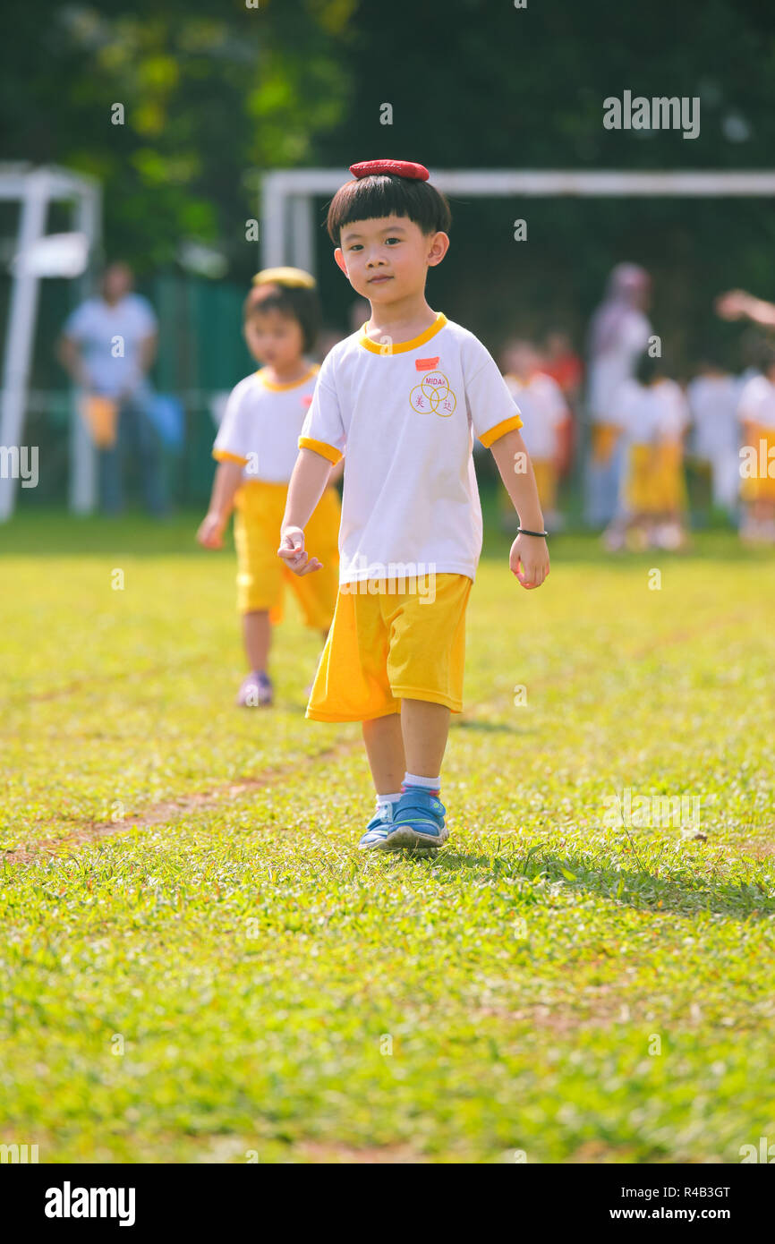 Children playing bean bag competition during their kindergarten sports