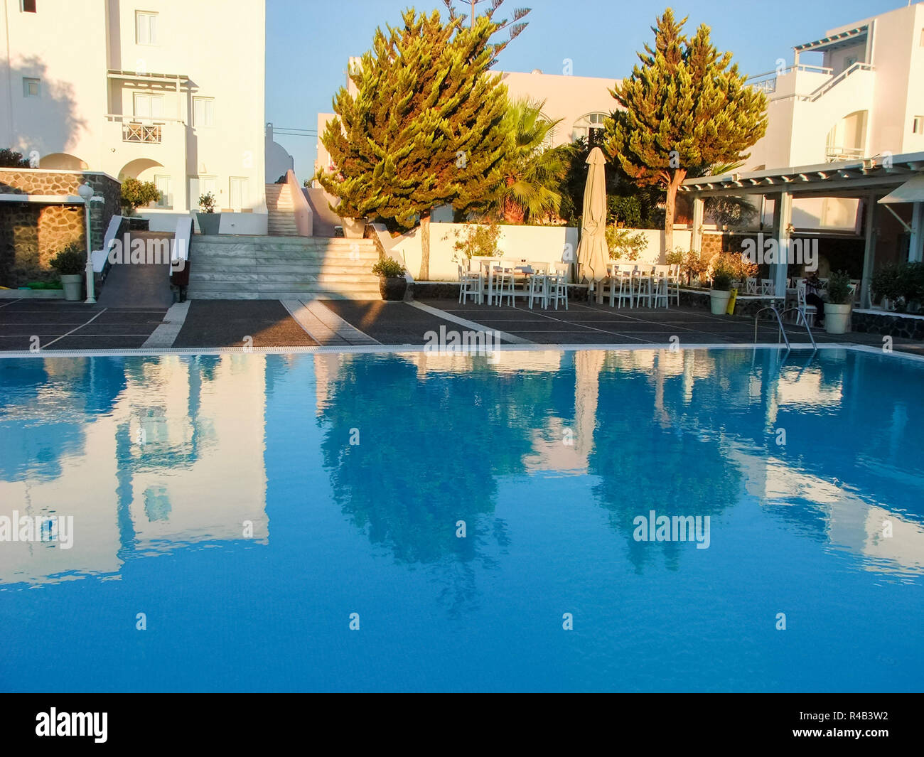 Luxury hotel with a clean swimming pool at Santorini, Greece. Stock Photo