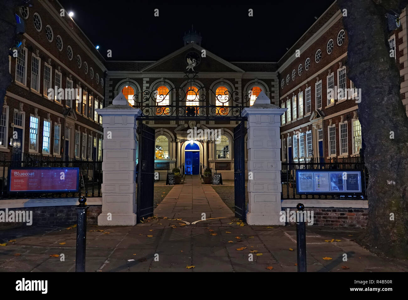 Built in 1716-17 as a school, Bluecoat Chambers in School Lane is the oldest surviving building in central Liverpool, UK. Shown lit up at nighttime. Stock Photo