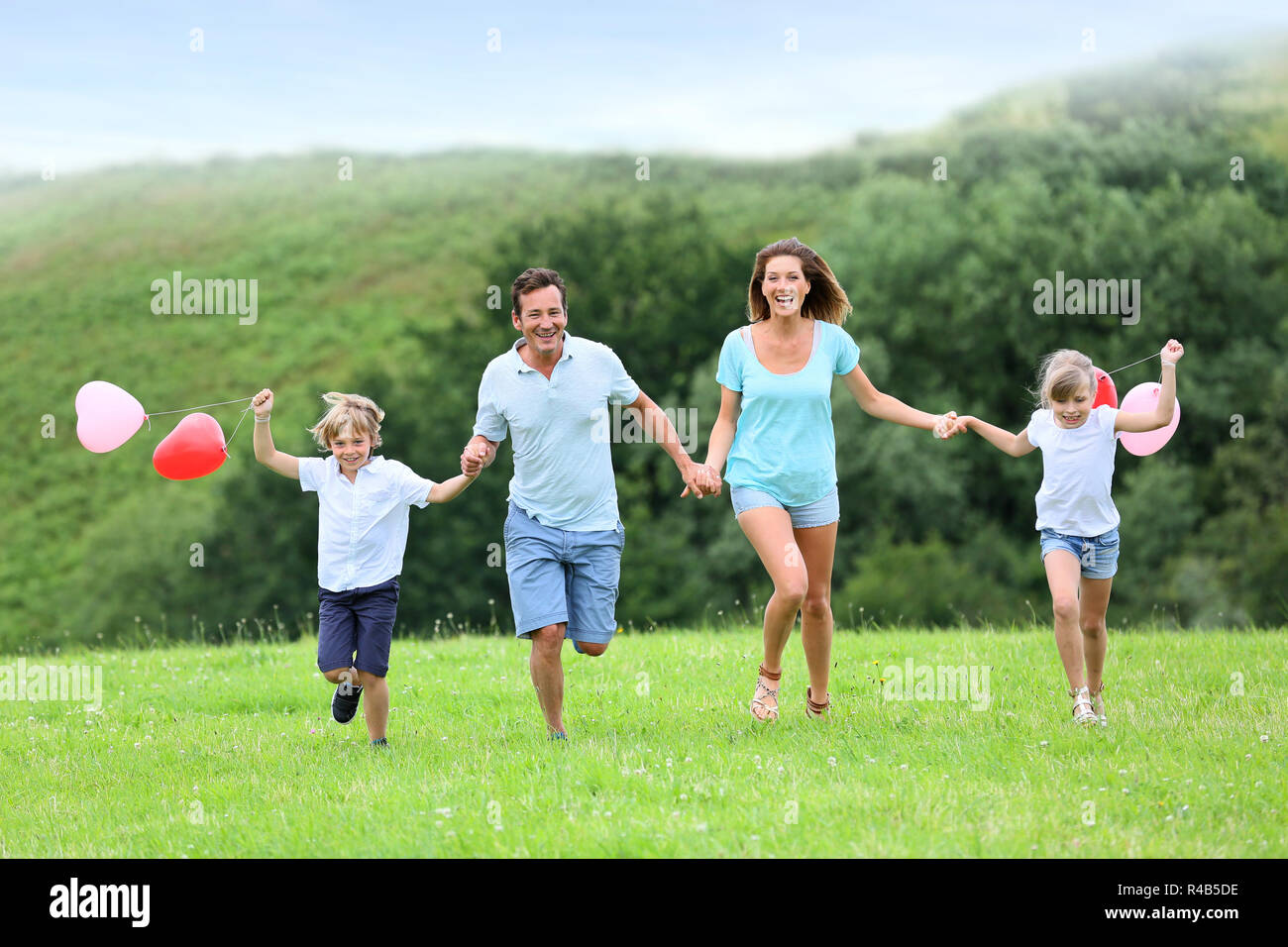 Happy family child play runs hi-res stock photography and images - Alamy