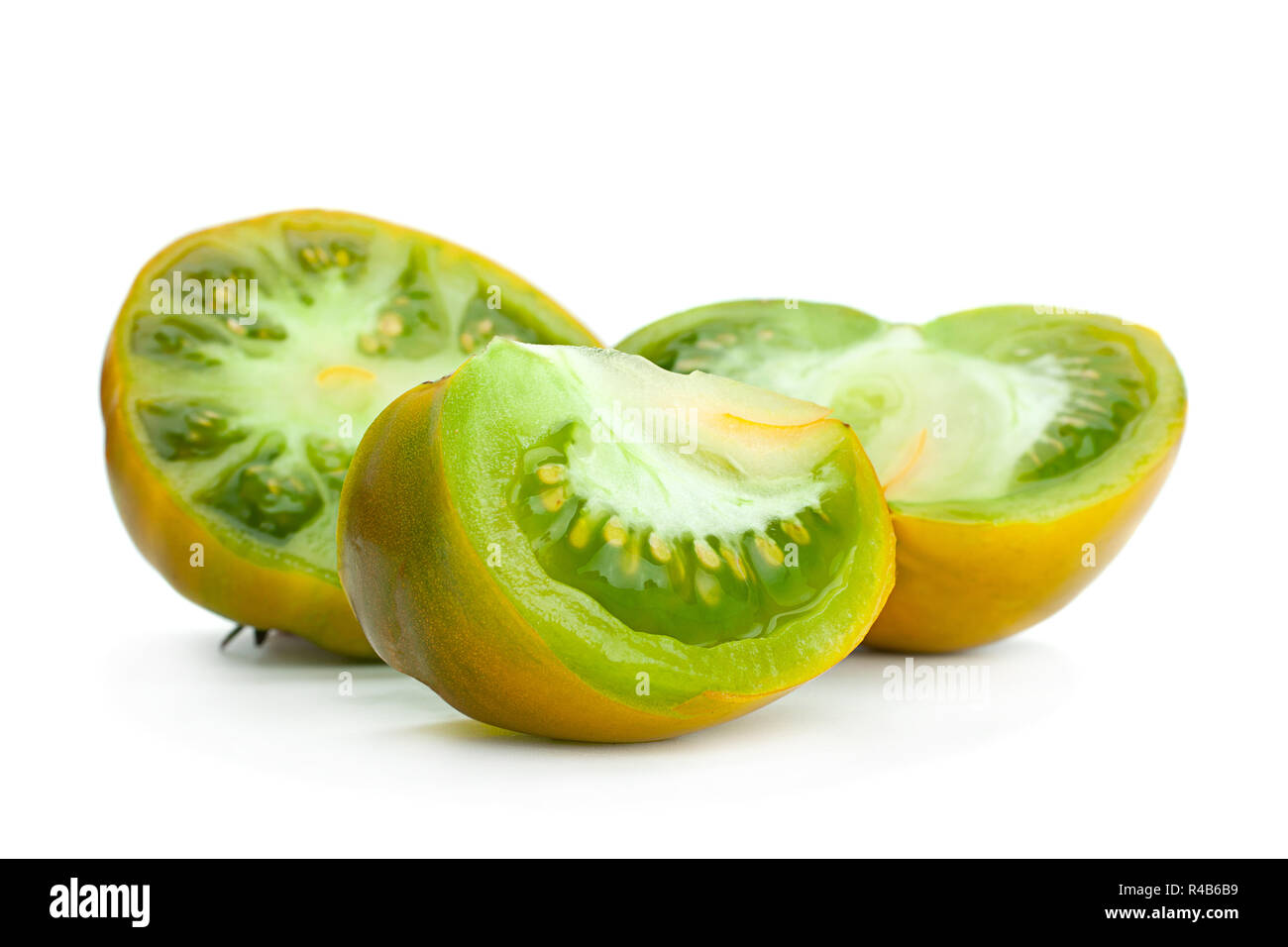 Green ripe tomatoes "Magic Glow" isolated on white Stock Photo - Alamy