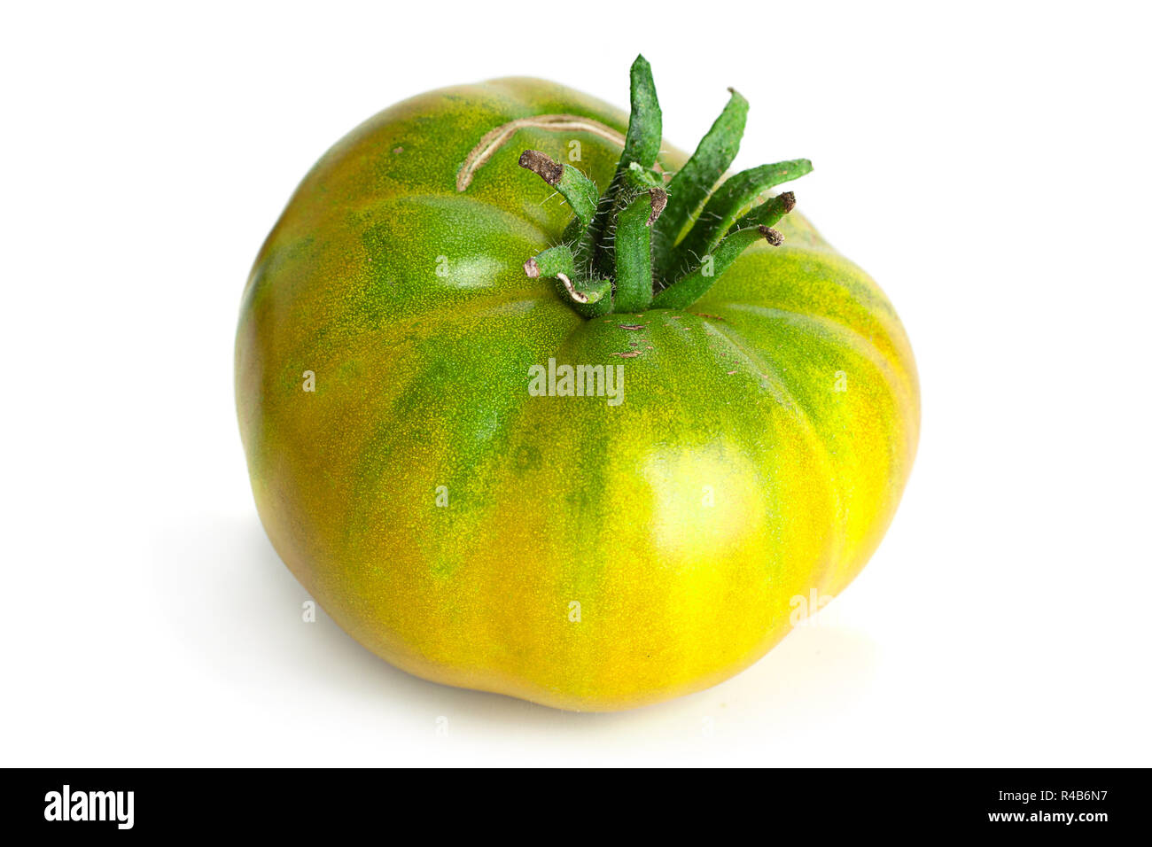 Green ripe tomatoes "Magic Glow" isolated on white Stock Photo - Alamy