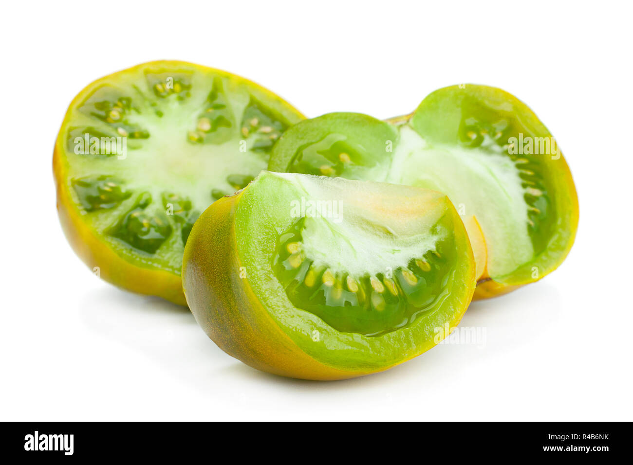 Green ripe tomatoes "Magic Glow" isolated on white Stock Photo - Alamy