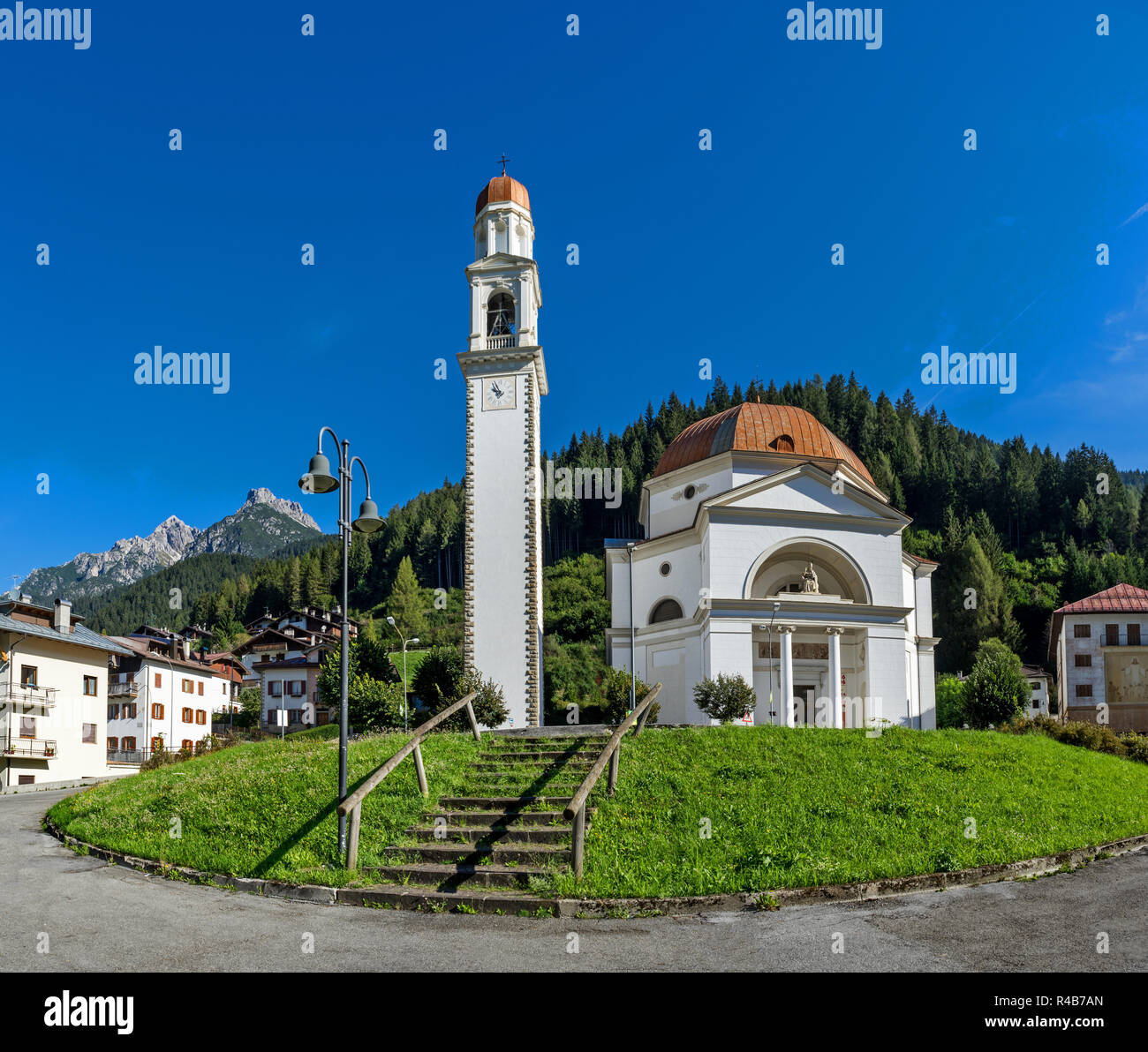 A church in the village of Auronzo di Cadore in the Dolomites region of Italy. Stock Photo