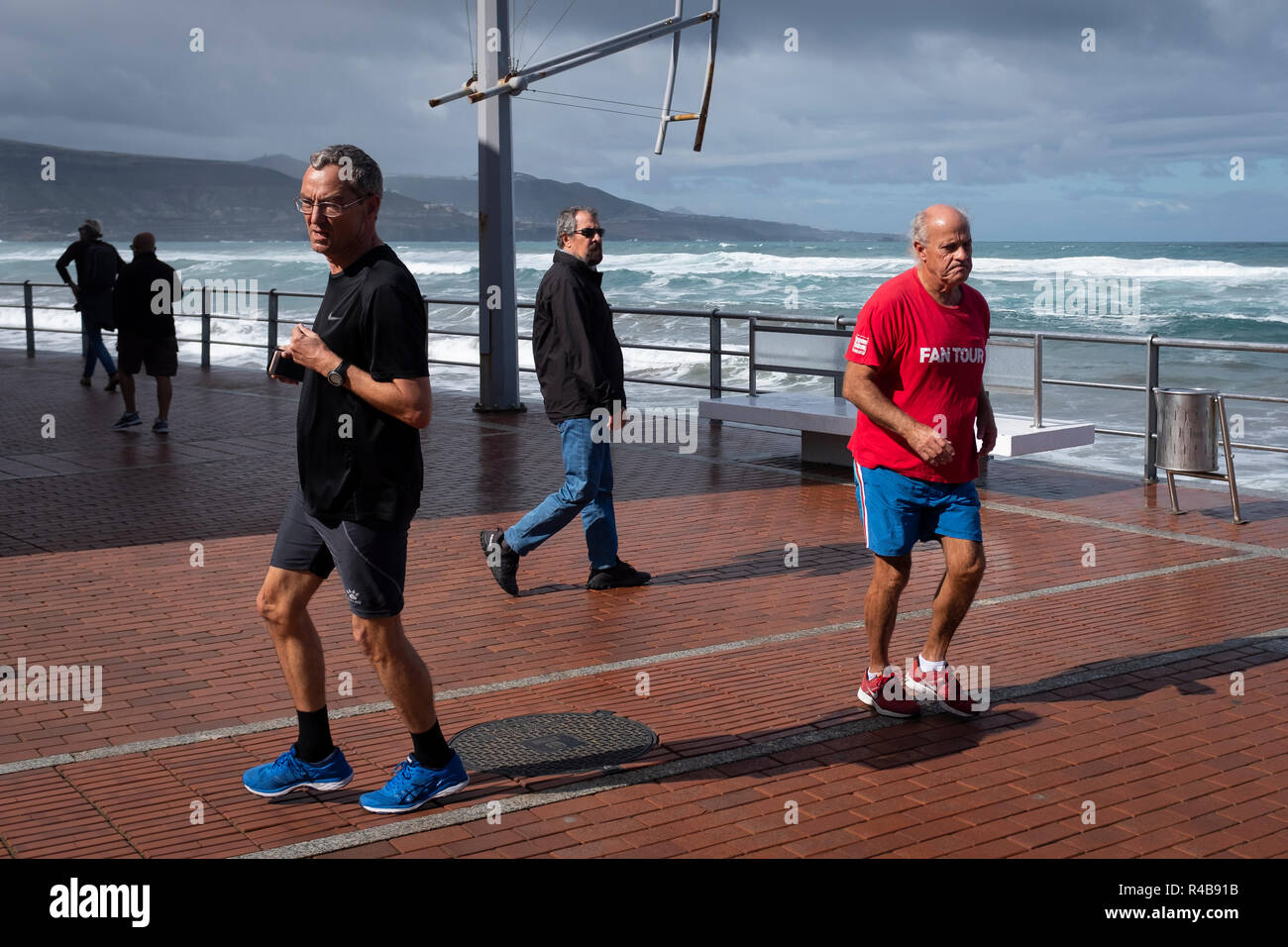 seniors doing exercise on the beach of las Canteras in Las Palmas de Gran Canaria Stock Photo