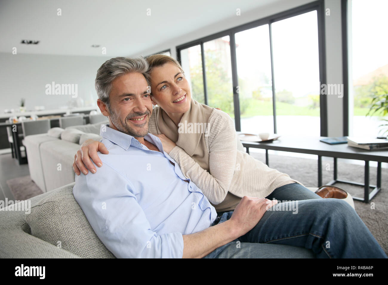 Portrait of mature couple relaxing at home Stock Photo - Alamy